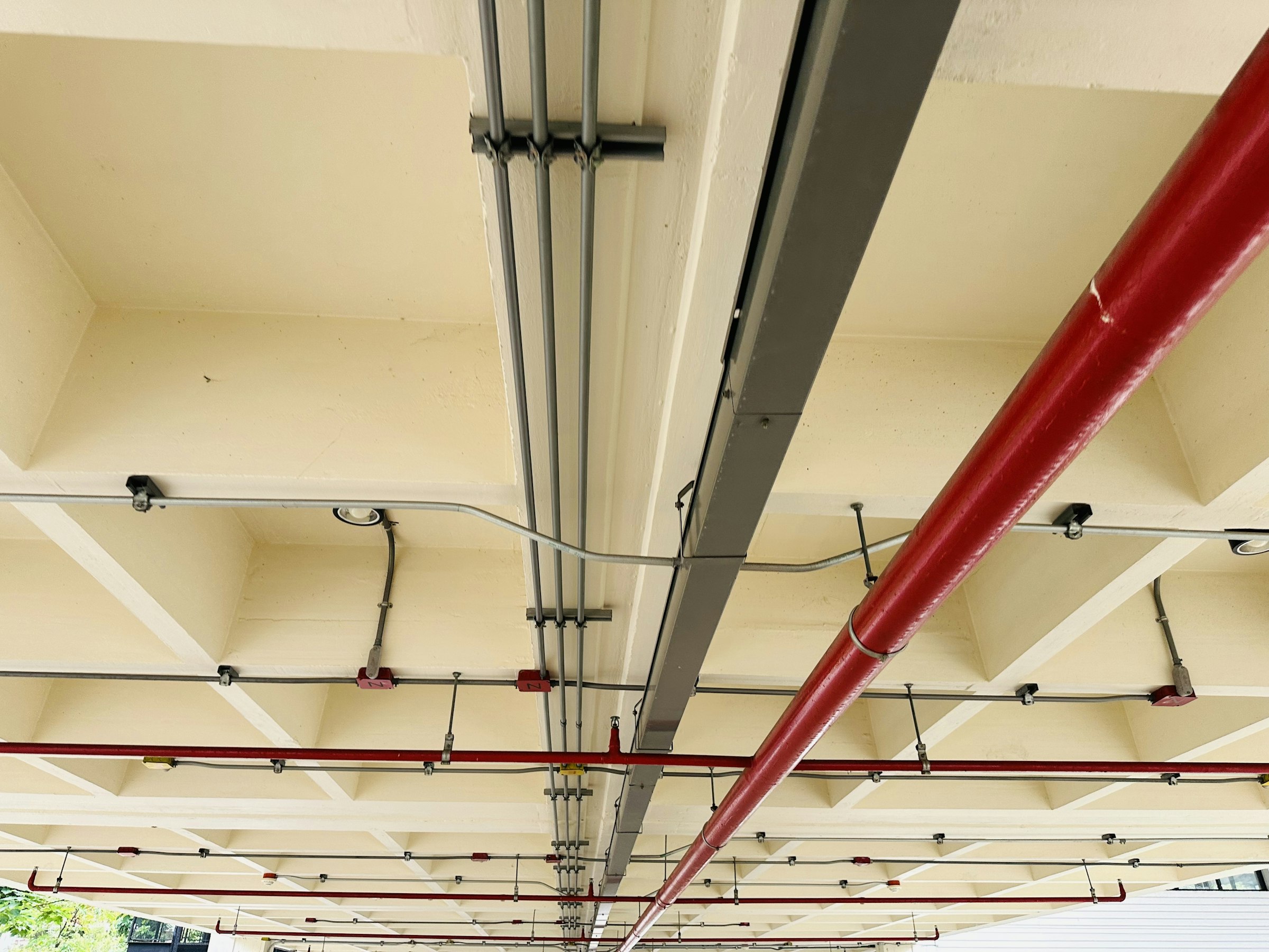 Electrical conduit runs installed across a commercial ceiling